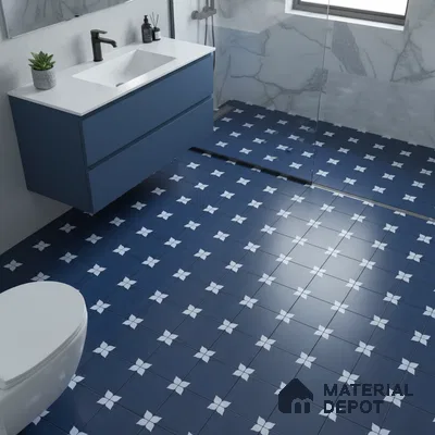 Modern bathroom with blue patterned floor tiles, blue vanity laminate, and marble wall tiles