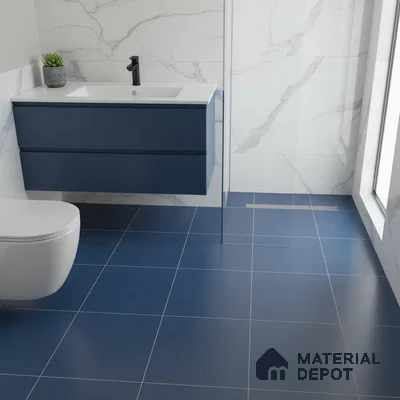 Modern bathroom with blue floor tiles, marble-look wall tiles, and navy blue floating vanity