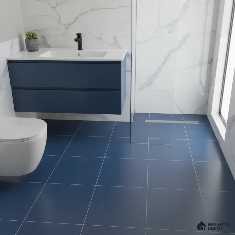 Modern bathroom with blue floor tiles, marble-look wall tiles, and navy blue floating vanity