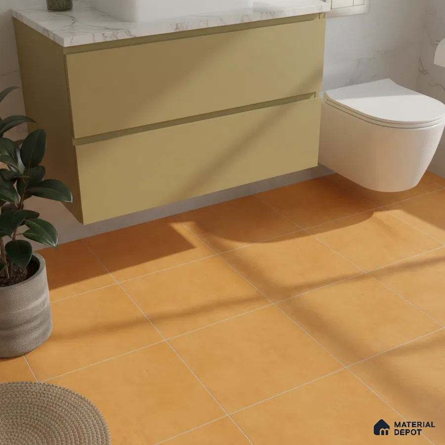 Modern bathroom with mustard yellow vanity, white marble countertop, and matte terracotta floor tiles