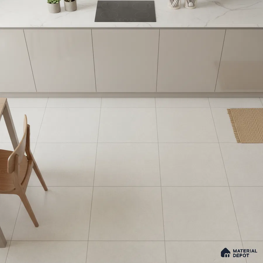 Minimalist kitchen with glossy beige laminate cabinets, white marble-look countertop, and large format light beige floor tiles