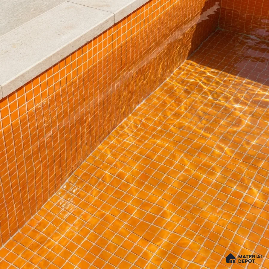 Mediterranean Swimming Pool with Orange Glass Mosaic Tile and Stone Coping