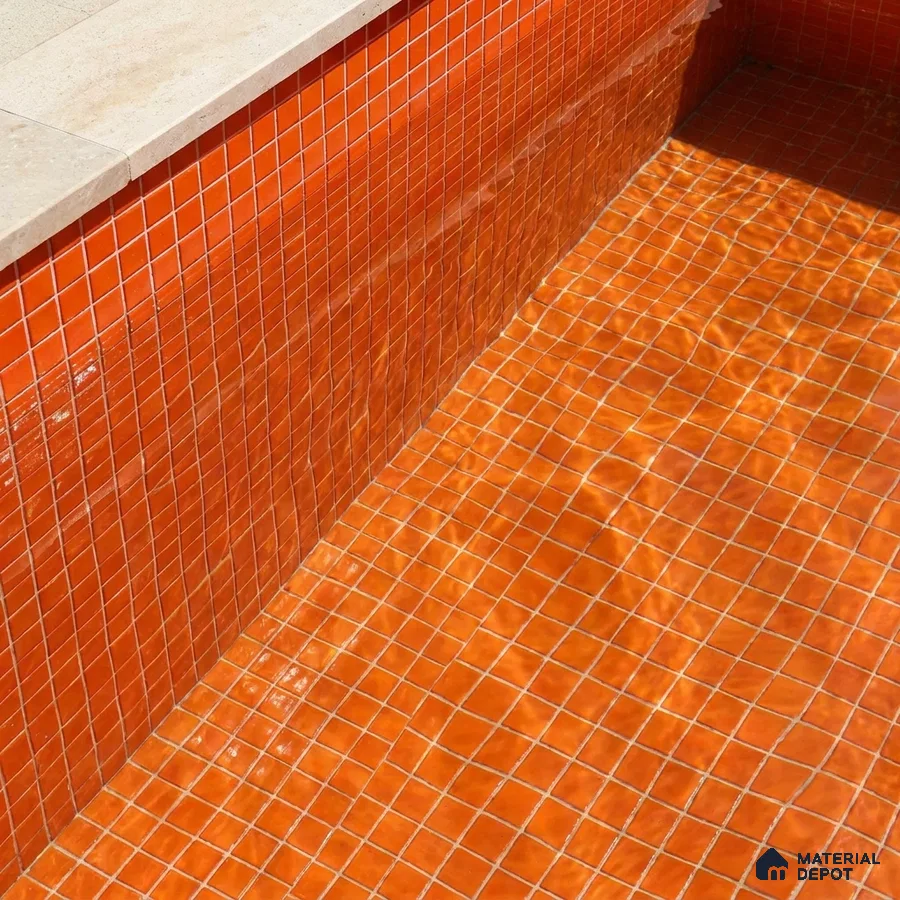 Mediterranean Swimming Pool with Burnt Orange Glass Mosaic Tile and Stone Coping