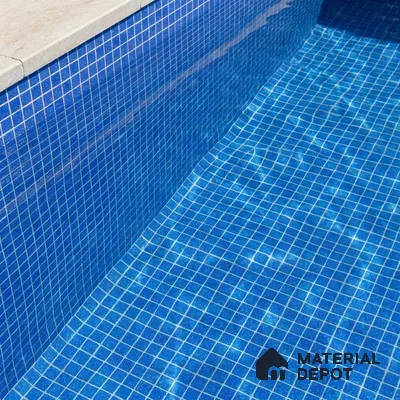 Mediterranean Swimming Pool with Cobalt Blue Glass Mosaic Tile and Stone Coping