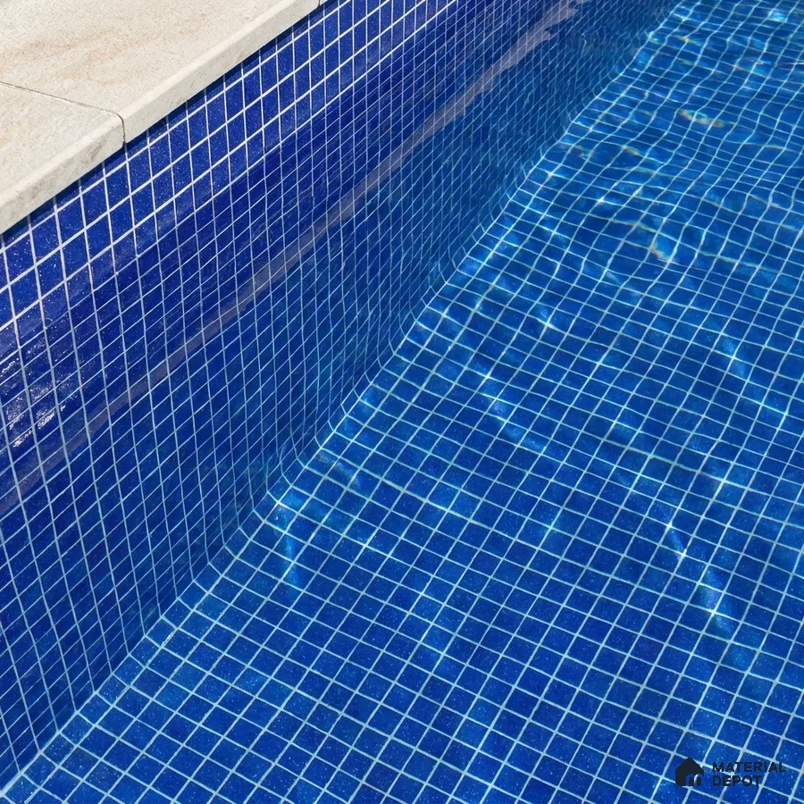 Mediterranean Swimming Pool with Royal Blue Glass Mosaic Tile and Stone Coping