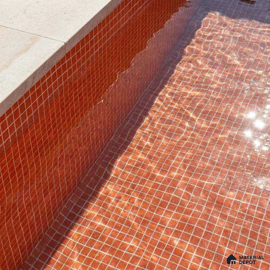 Mediterranean Swimming Pool with Rust Terracotta Glass Mosaic Tile and Stone Coping