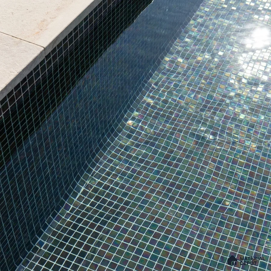 Modern Swimming Pool with Iridescent Dark Glass Mosaic Tile and Stone Coping
