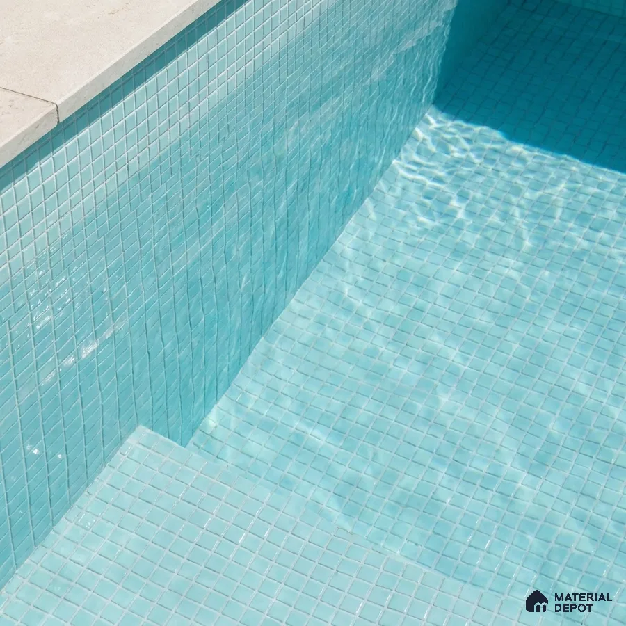 Modern Swimming Pool with Aqua Glass Mosaic Tile and Stone Coping