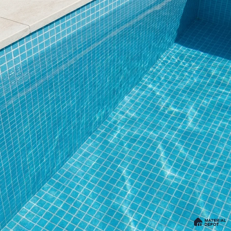 Modern Swimming Pool with Bright Blue Glass Mosaic Tile and Stone Coping