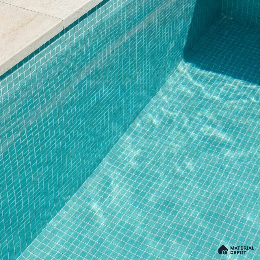 Modern Swimming Pool with Teal Glass Mosaic Tile and Stone Coping