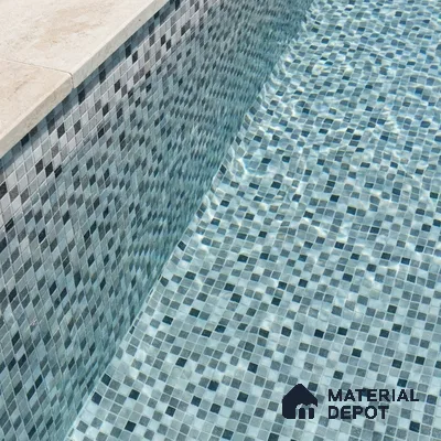 Modern Swimming Pool with Grey Glass Mosaic Tile and Cream Stone Coping
