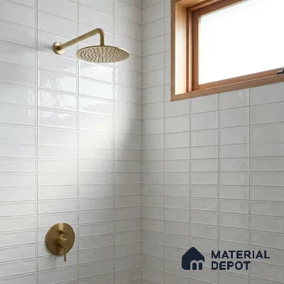 Modern Bathroom with Frosty White Glossy Stacked Tile and Brass Fixtures