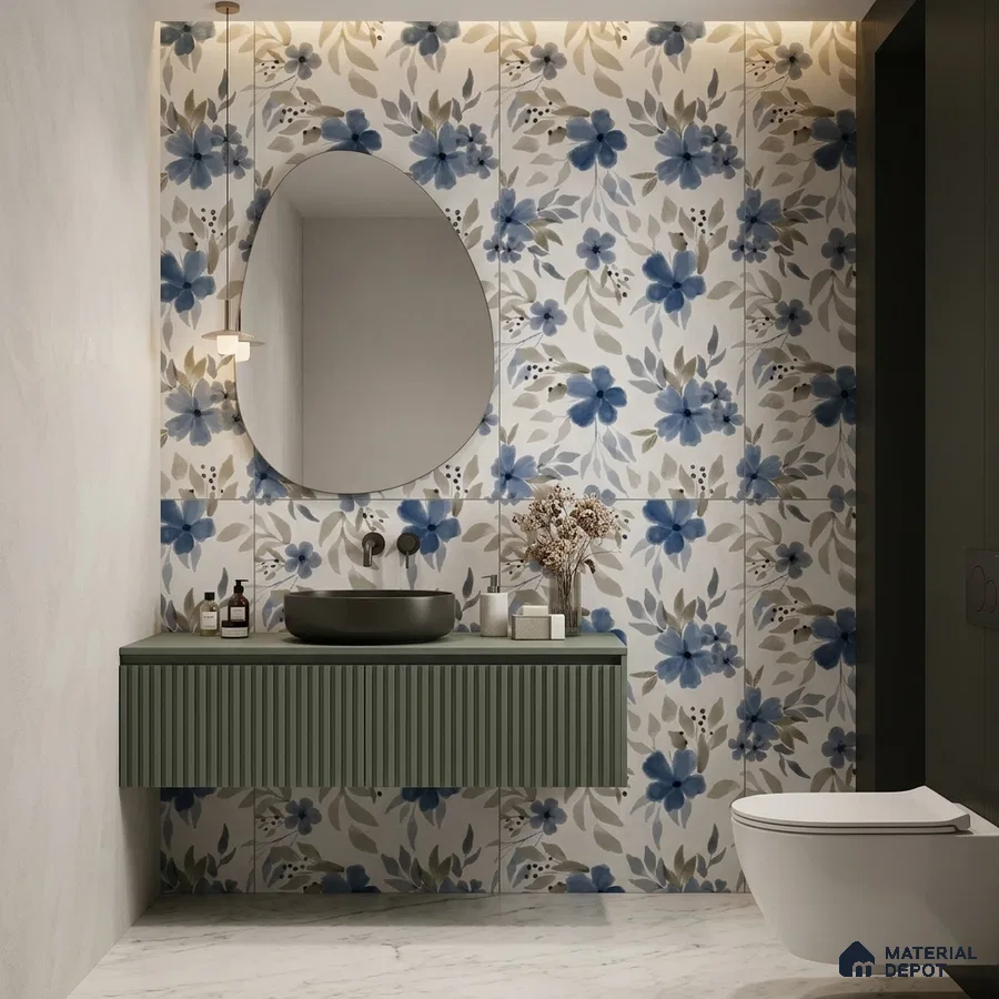 Modern bathroom with blue floral wall tiles, olive green fluted vanity, and white marble floor tile