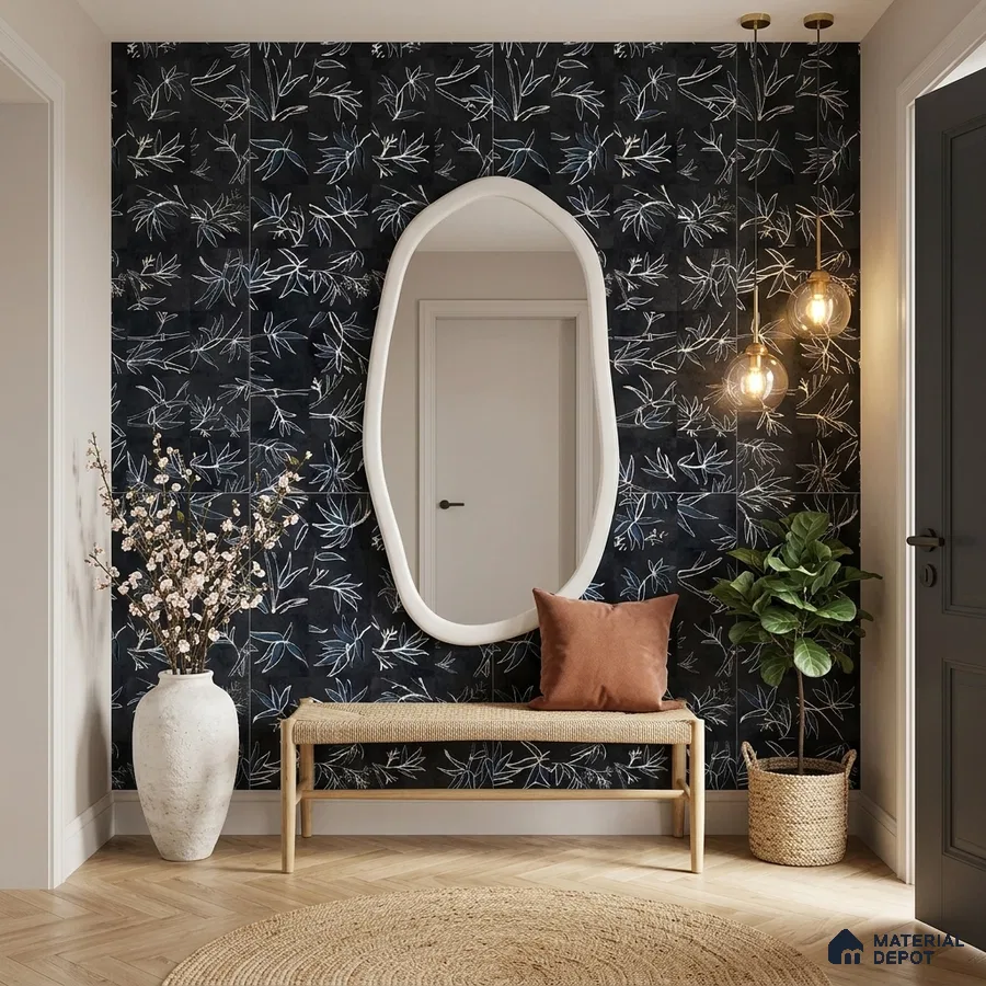 Modern foyer with black floral tile, light wood bench, and herringbone wooden flooring