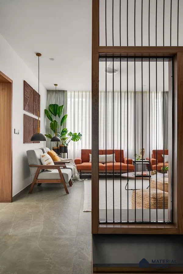 Tranquil Living Space with Vertical Bar Partition and Warm Accents | Material Depot