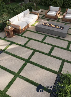 Tranquil Outdoor Patio with Beige Porcelain Tile Flooring, Fire Pit, and Lush Greenery | Material Depot