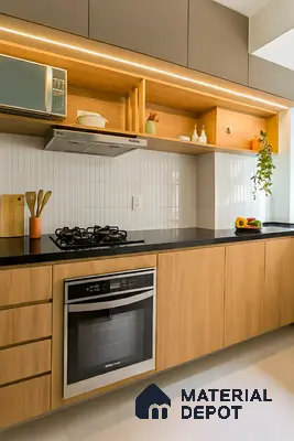 Modern kitchen with light oak wood laminate, black quartz countertop, and white vertical subway backsplash tiles of 3 BHK apartment in Vaishno Signature Hoodi Bengaluru