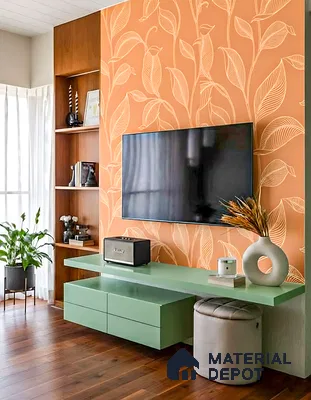 Modern living room with sage green laminate TV unit, orange floral wallpaper, and walnut wood flooring of 3 BHK apartment in Vaishno Signature Hoodi Bengaluru