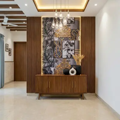 Modern foyer with walnut wood laminate, marble accent wall, and gold decorative profiles