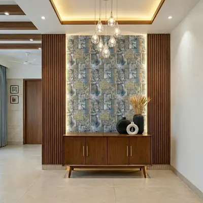 Mid-century modern foyer with wooden fluted panels, patterned wallpaper, and beige floor tiles