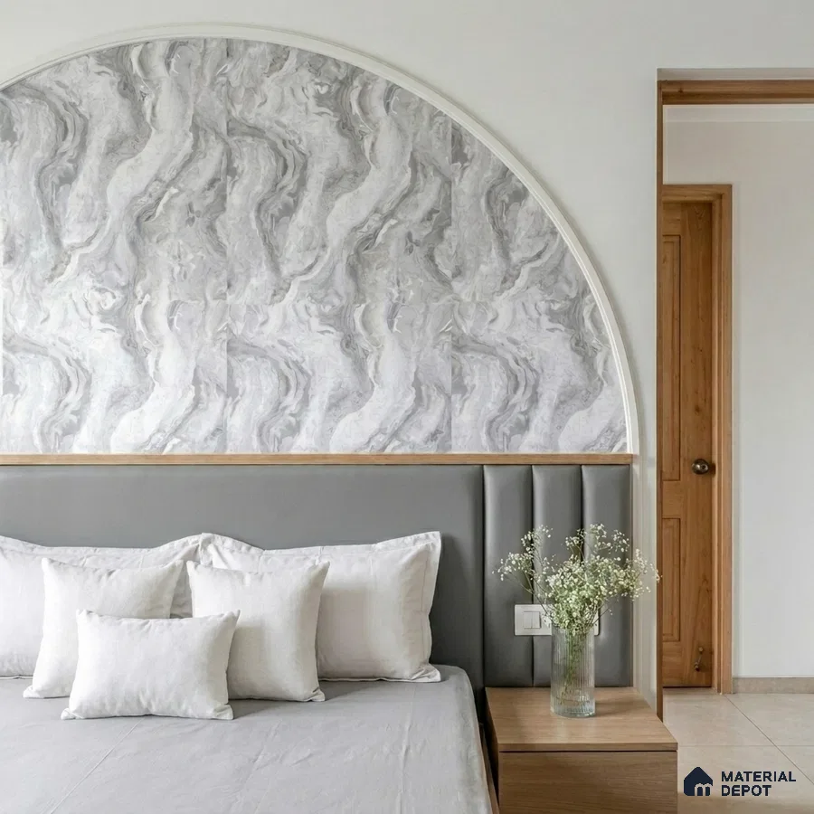 Minimalist bedroom with grey marble-look wallpaper accent and upholstered headboard