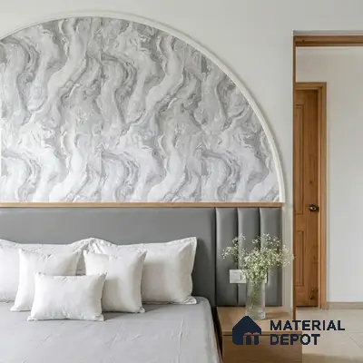 Minimalist bedroom with grey marble-look wallpaper accent and upholstered headboard