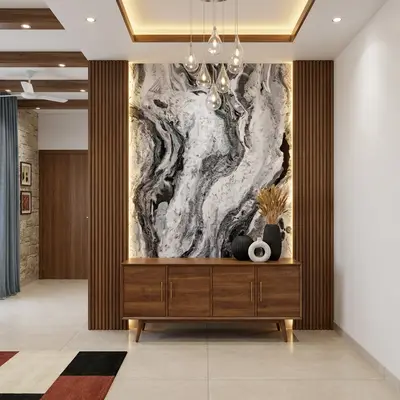 Modern foyer with walnut wood laminate console, marble-look accent wall, and fluted wood panels