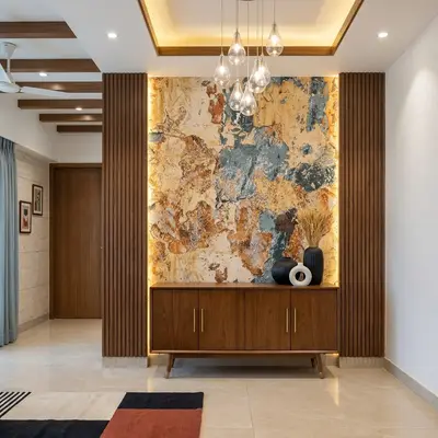 Mid-century modern foyer with abstract stone accent wall, walnut wood louvers, and beige marble floor tile
