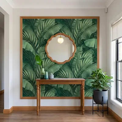 Modern foyer with tropical green wallpaper, natural wood console, and wooden flooring