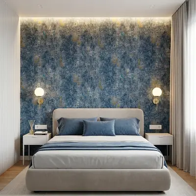 Modern bedroom with blue patterned wallpaper, suede upholstered bed, and white fluted wall panels