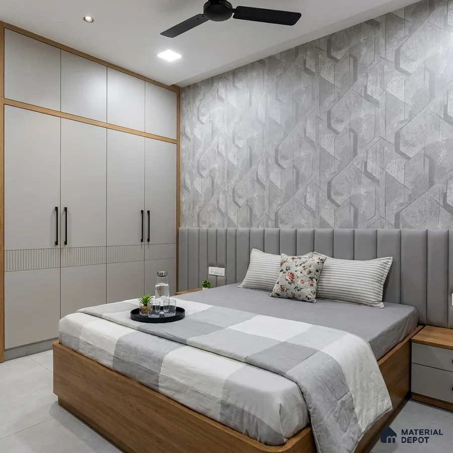 Modern bedroom with grey geometric wallpaper, matte grey laminate wardrobe, and light wood bed frame