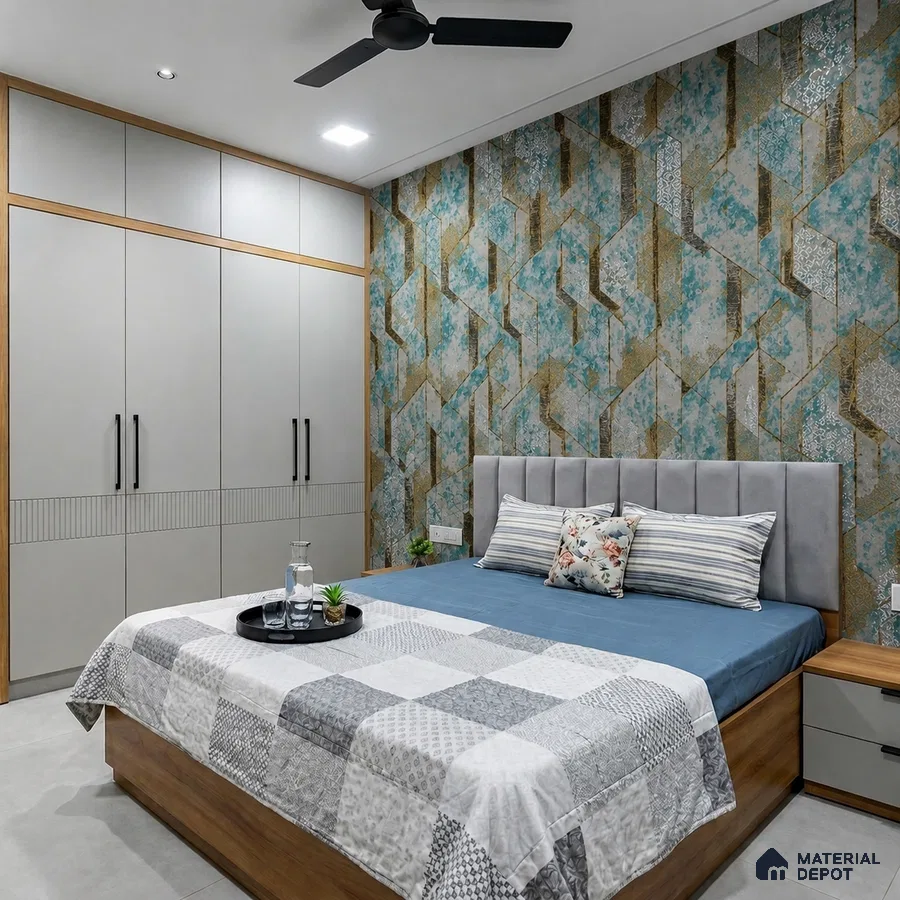 Modern bedroom with geometric blue and gold wallpaper, grey upholstered headboard, and matte beige wardrobe laminate
