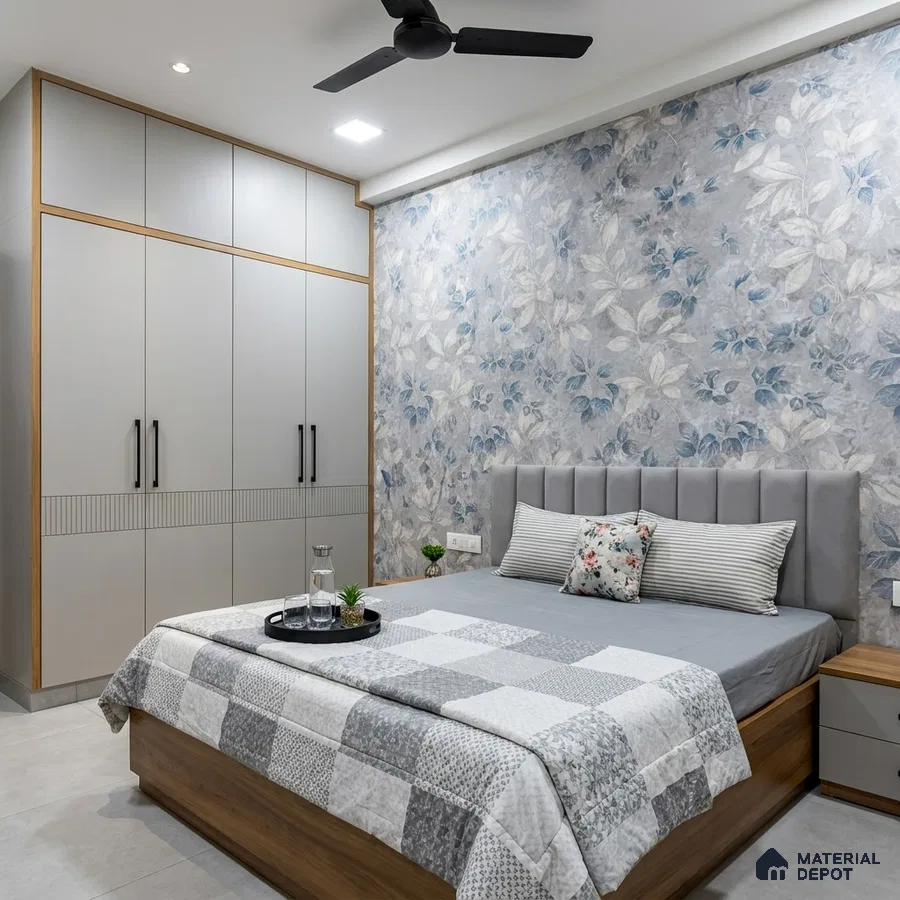 Modern bedroom with floral wallpaper, grey laminate wardrobe, and wooden bed base