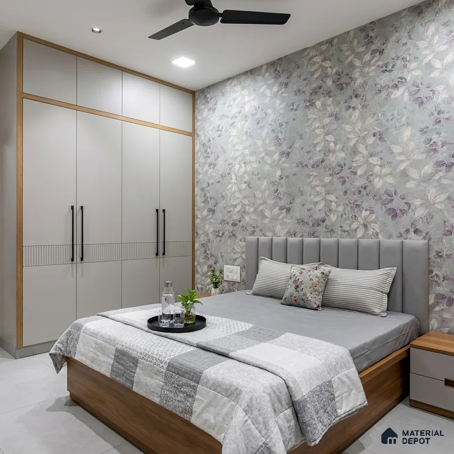 Modern bedroom with floral wallpaper, grey solid laminate wardrobe, and wooden bed frame