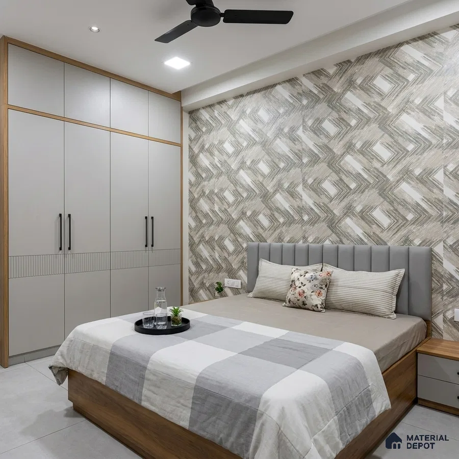 Modern bedroom with geometric patterned wallpaper, grey solid color laminate wardrobe, and light wood bed frame