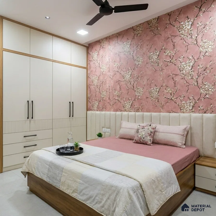 Modern bedroom with blush floral wallpaper, beige upholstered headboard, and cream laminate wardrobe