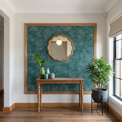 Modern foyer with teal patterned wallpaper, natural wood console, and wooden flooring