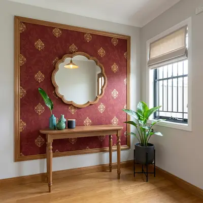 Traditional foyer with red patterned wallpaper, natural wood console, and wooden flooring