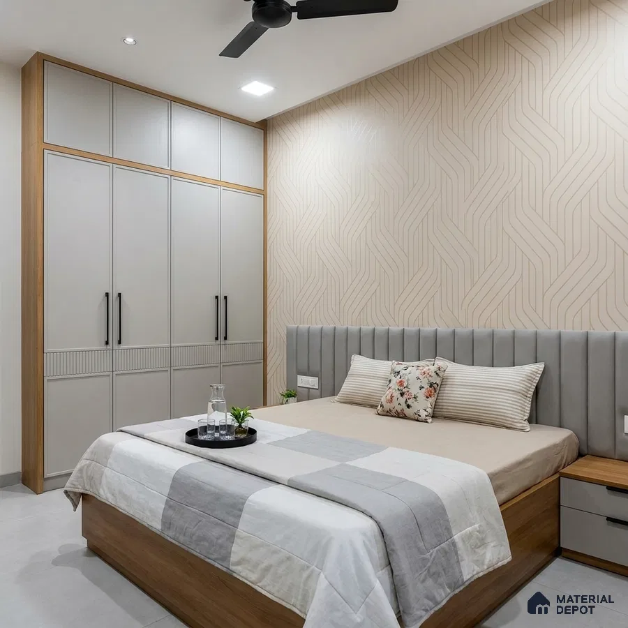 Modern bedroom with beige geometric wallpaper, grey upholstered headboard, and dual tone wardrobe with wood accents