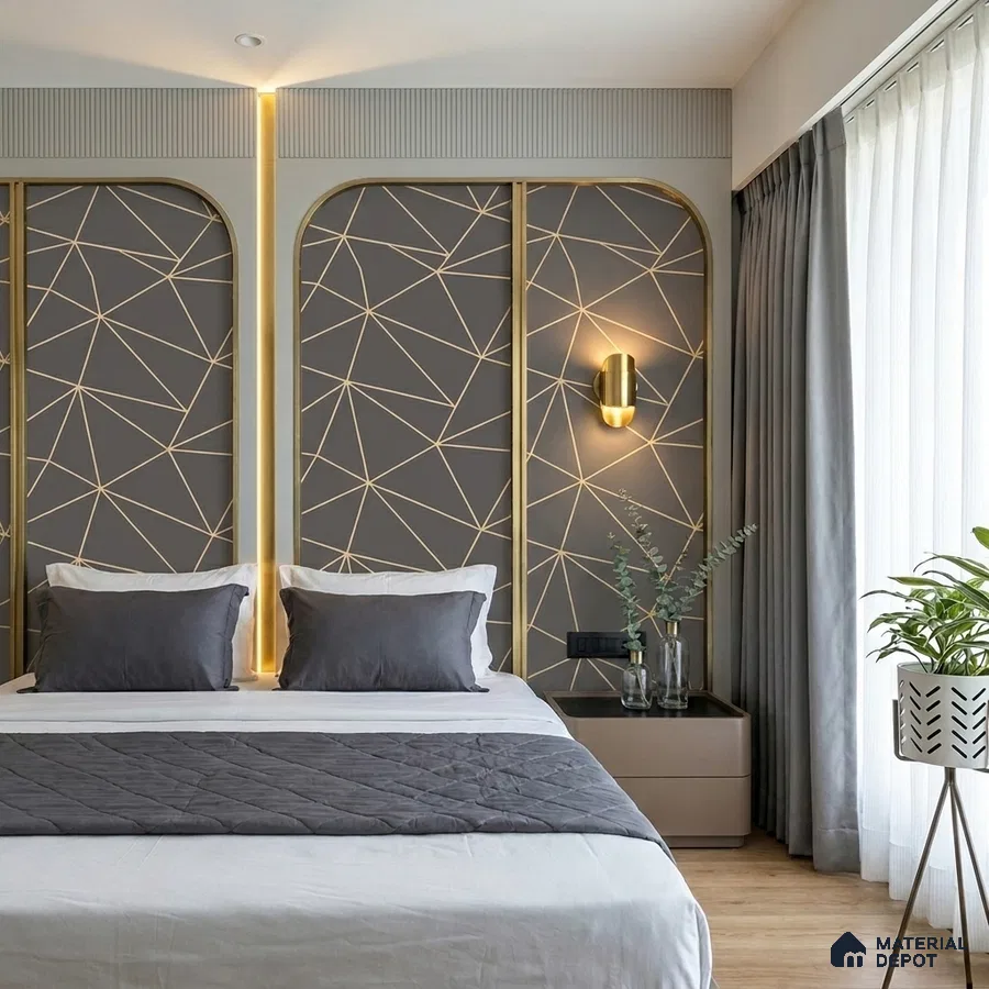 Modern bedroom with geometric gold-accent wall panels and grey upholstery
