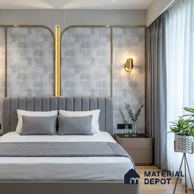 Modern bedroom with grey suede upholstered bed, textured wallpaper, and gold accent profiles
