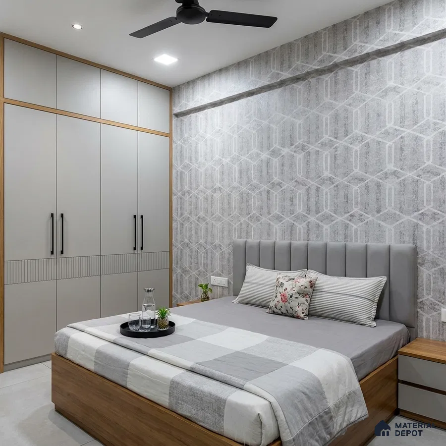 Minimalist bedroom with grey geometric wallpaper, matte grey laminate wardrobe, and light wood bed frame