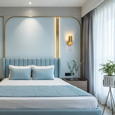 Modern bedroom with pastel blue suede upholstered bed and textured wallpaper accent wall