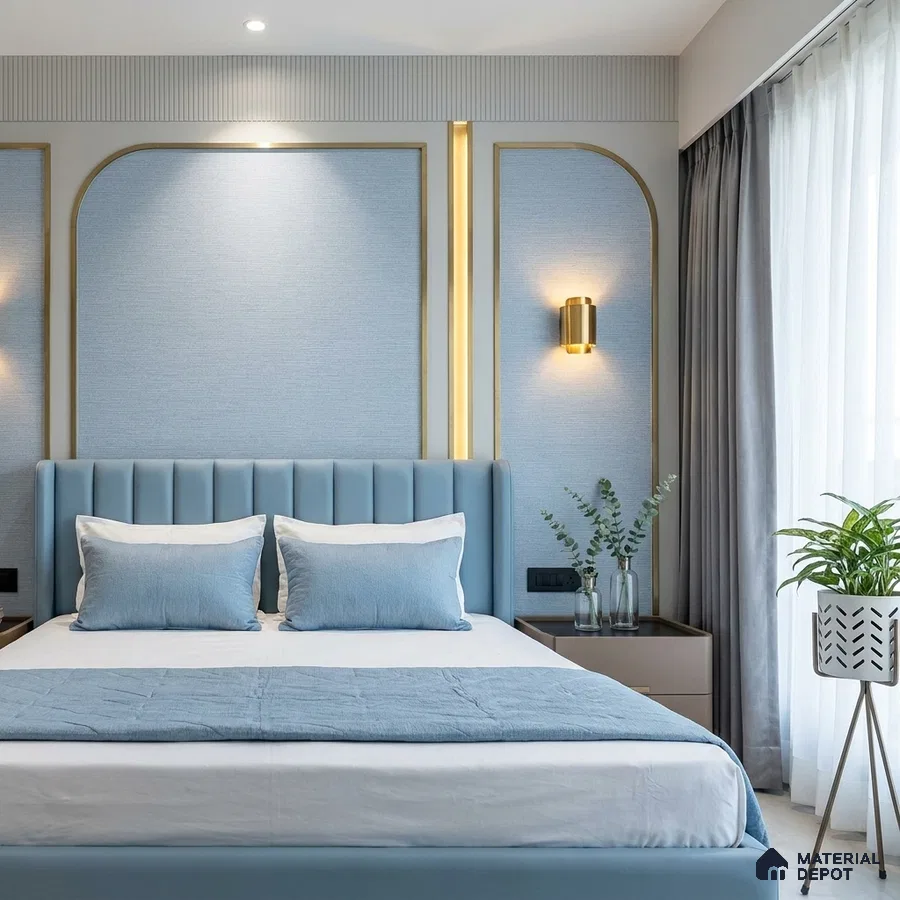 Modern bedroom with powder blue upholstered bed, textured blue wallpaper, and gold accent wall panels