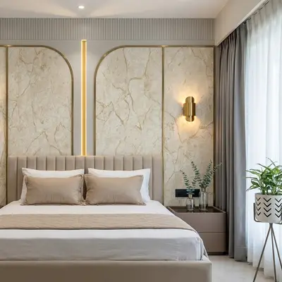 Modern bedroom with beige marble laminate accent wall and suede upholstered bed