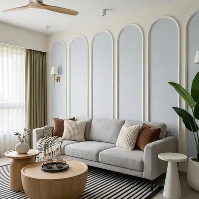 Scandinavian living room with arched wall panels, light wood tables, and neutral fabric sofa