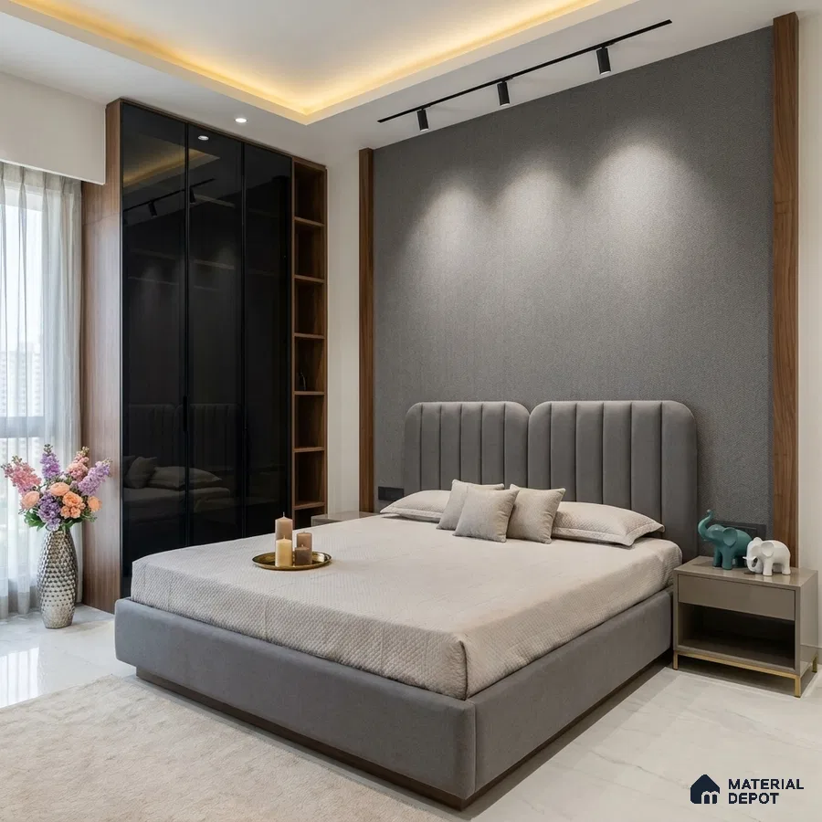 Modern bedroom with grey fabric upholstered bed, walnut wood accents, and glass wardrobe shutters