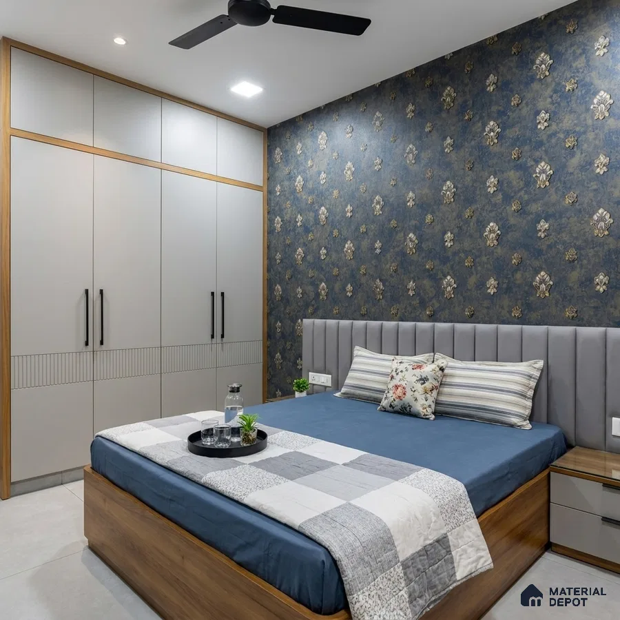 Modern bedroom with floral wallpaper, grey upholstered headboard, and matte beige wardrobe laminate