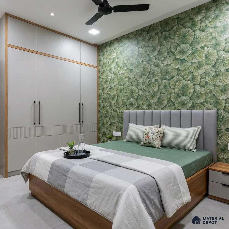 Modern bedroom with green floral wallpaper, grey solid laminate wardrobe, and wooden bed frame