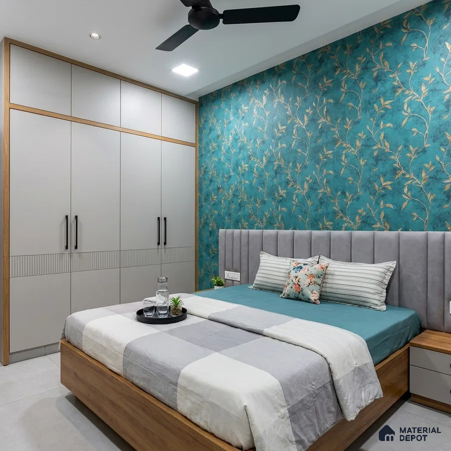Modern bedroom with teal floral wallpaper, grey upholstered headboard, and matte beige wardrobe laminate